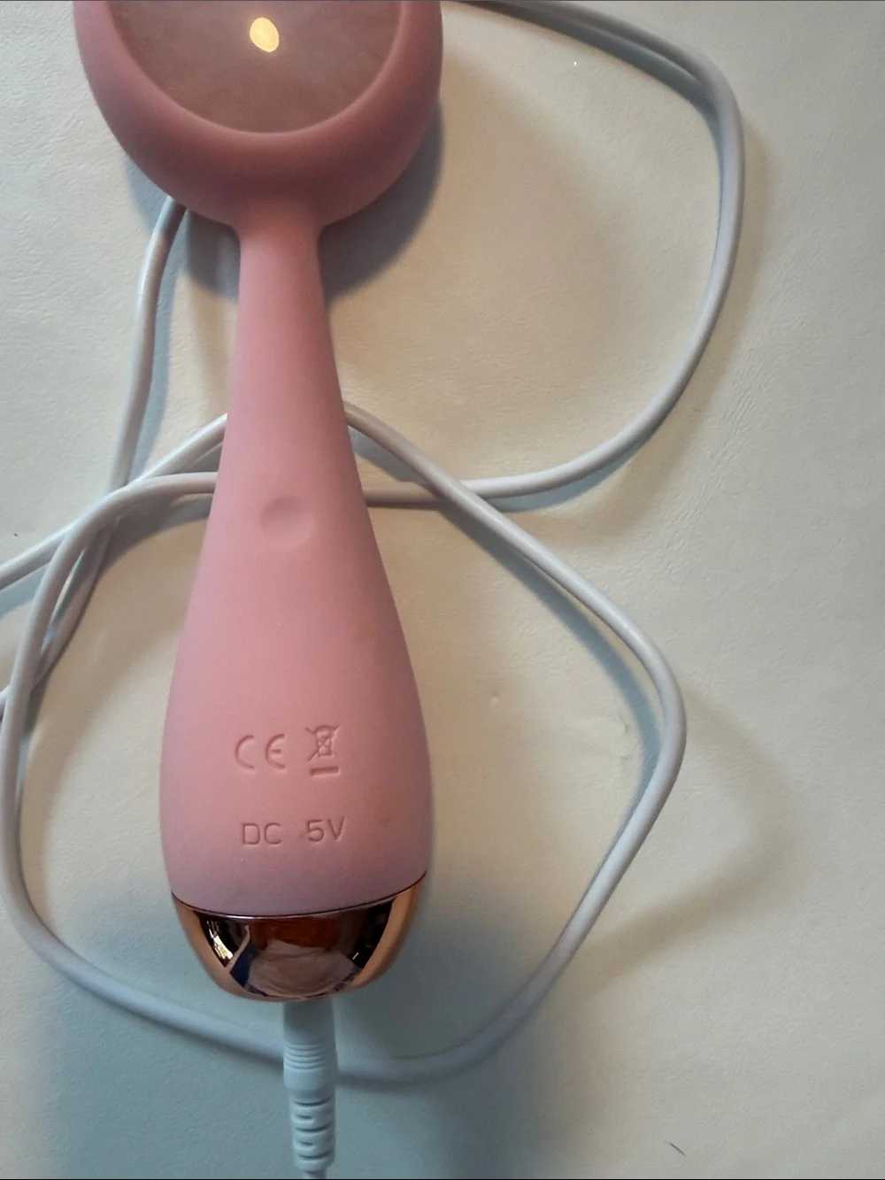 PMD Pink Facial Massager with Rose Gold Accent and White Cable